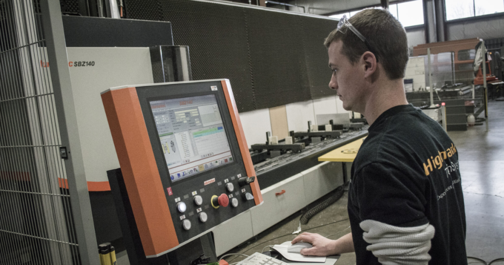 Highmark employee working on structure build at computer