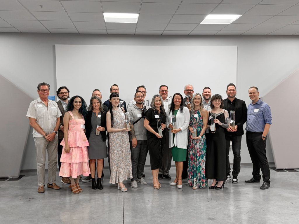 Debbie Parrott standing with fellow ExSys award winners