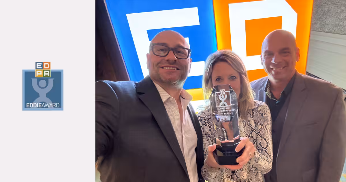 Matt Andrews, Brian Baker, and Debbie Parrott holding EDDIE award trophy